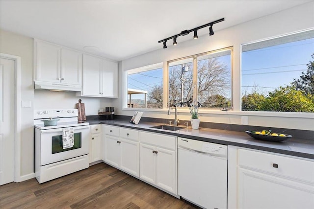 kitchen featuring sink, track lighting, dark hardwood / wood-style flooring, white appliances, and white cabinets