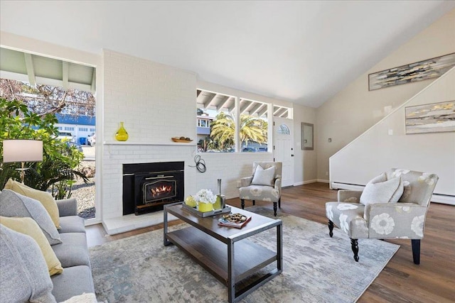 living room featuring a baseboard radiator, lofted ceiling, a fireplace, and dark hardwood / wood-style flooring