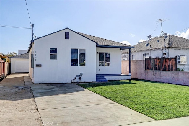 view of front of home with a garage and a front yard