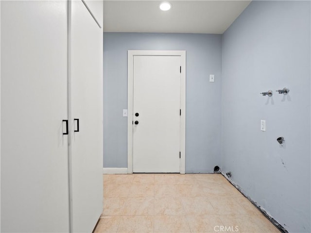 laundry room featuring light tile patterned floors