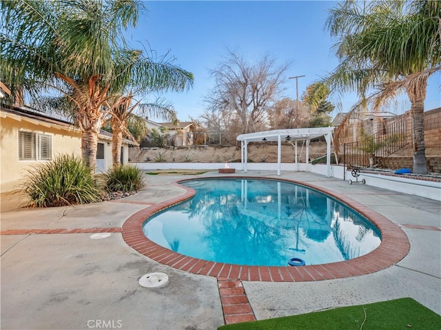 view of pool featuring a patio and a pergola