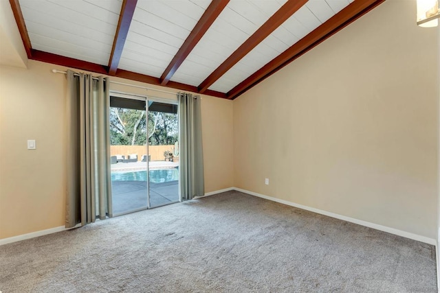 unfurnished room with lofted ceiling with beams and carpet