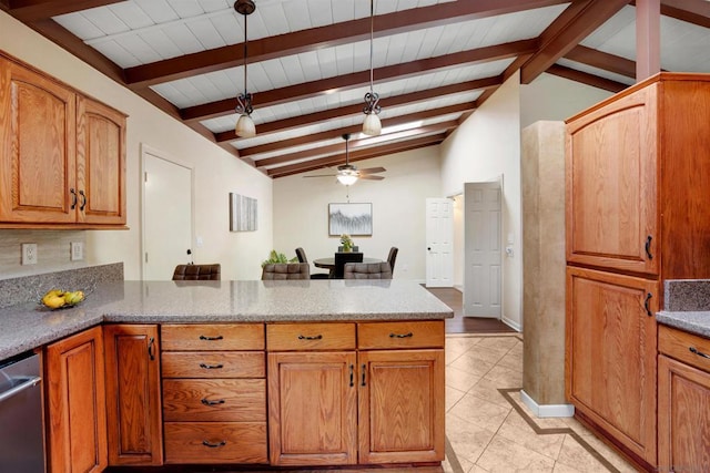 kitchen with pendant lighting, ceiling fan, vaulted ceiling with beams, light stone countertops, and stainless steel dishwasher