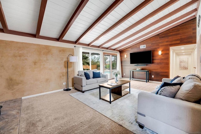 living room with vaulted ceiling with beams, light colored carpet, and wood walls