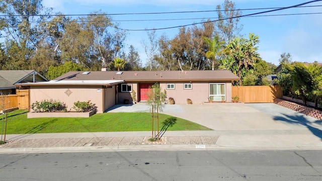 ranch-style house with a front lawn