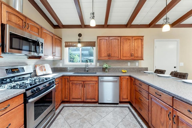 kitchen with decorative light fixtures, lofted ceiling with beams, sink, light tile patterned floors, and stainless steel appliances