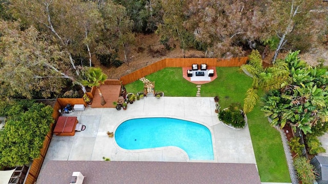 view of swimming pool featuring a yard, a jacuzzi, and a patio area