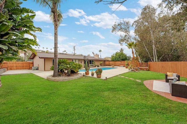 view of yard featuring a fenced in pool, an outdoor living space, and a patio area