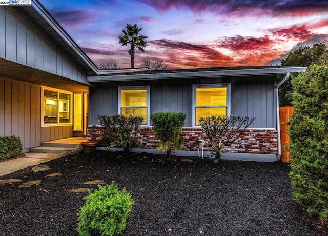 view of property exterior at dusk