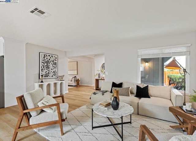 living room with light hardwood / wood-style floors