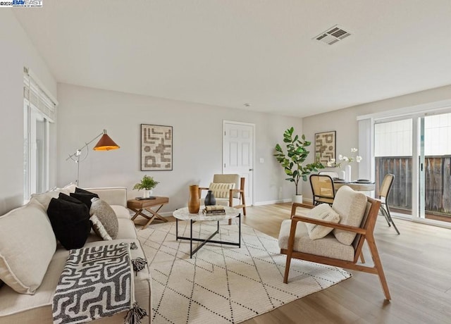 living room with light hardwood / wood-style floors