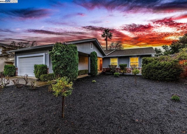 ranch-style home with a garage