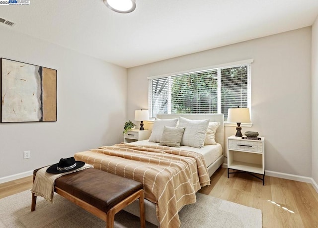 bedroom with light hardwood / wood-style flooring