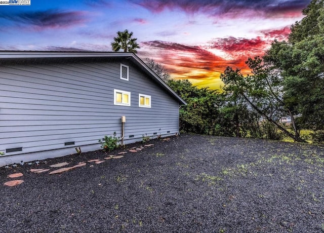 view of property exterior at dusk