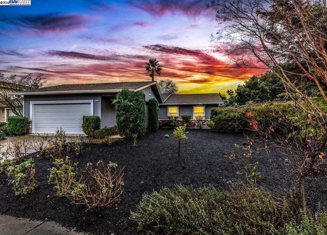 single story home featuring a garage