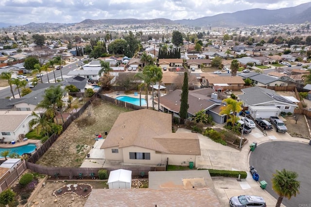 birds eye view of property with a mountain view