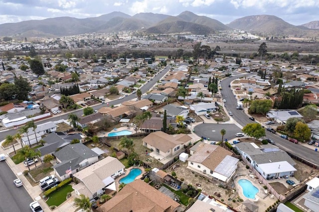 birds eye view of property with a mountain view