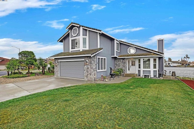 view of front of property featuring a garage and a front yard