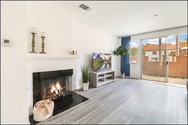 unfurnished living room featuring hardwood / wood-style floors