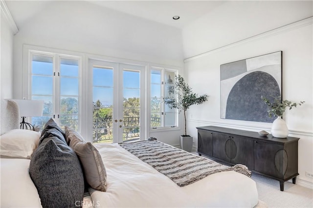 bedroom with access to outside, french doors, and vaulted ceiling