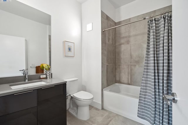 full bathroom with vanity, tile patterned floors, toilet, and shower / bath combo with shower curtain