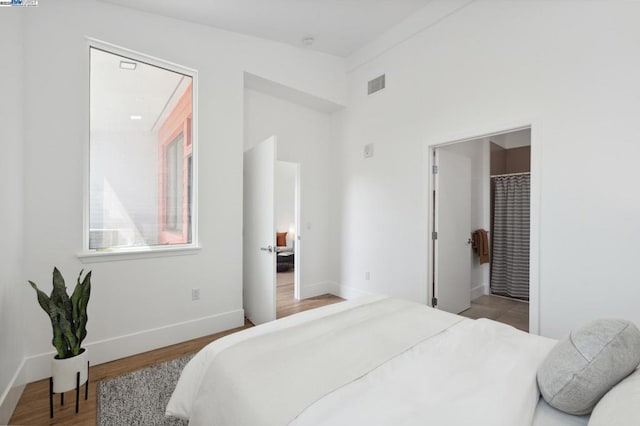 bedroom featuring hardwood / wood-style flooring