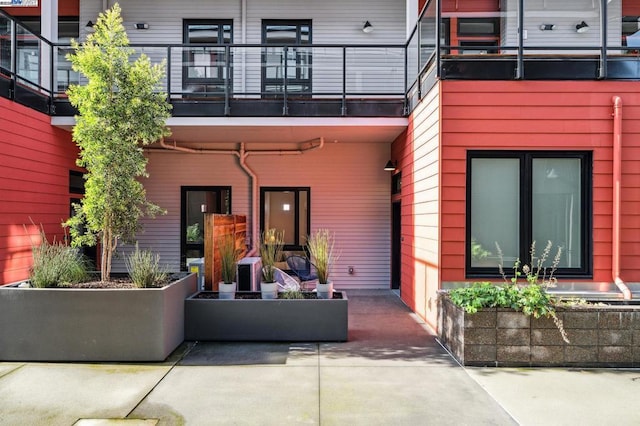 exterior space featuring a patio and a balcony