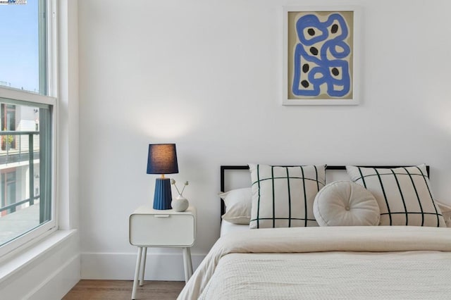 bedroom featuring wood-type flooring