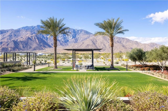 surrounding community featuring a mountain view and a yard