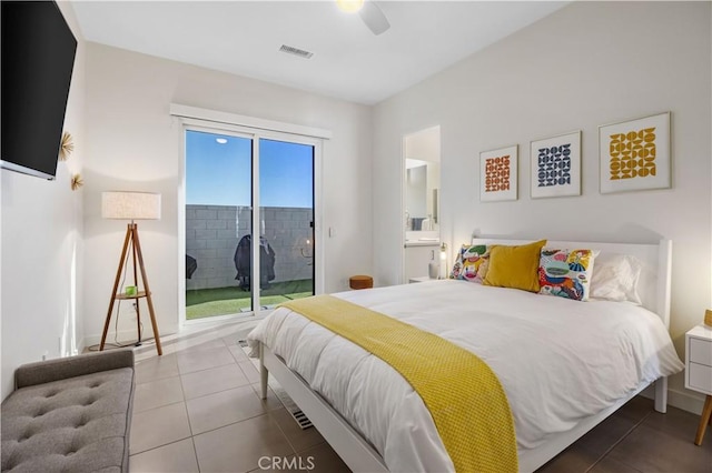 tiled bedroom with connected bathroom, access to exterior, and ceiling fan