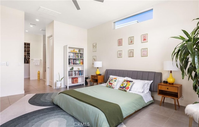 tiled bedroom featuring ceiling fan