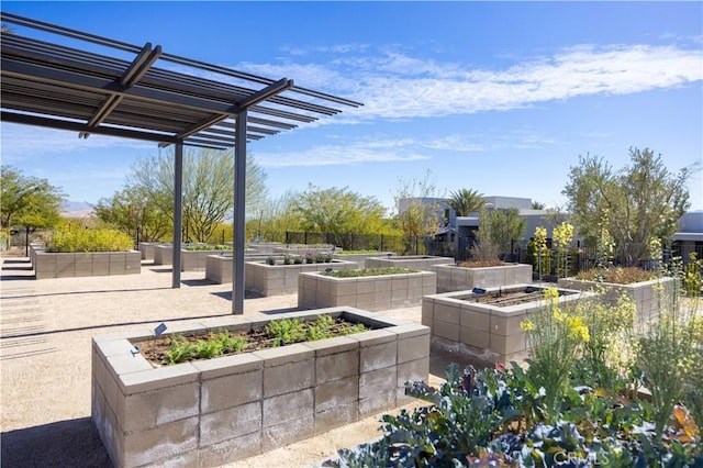 3712 Ambassador Dr, Palm Springs, CA 92262 - view of patio featuring a pergola and a garden