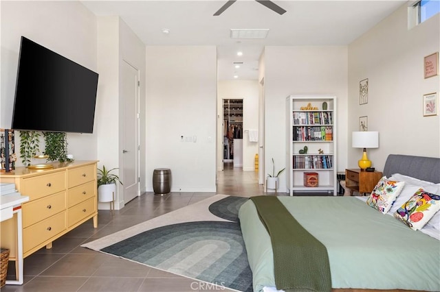 tiled bedroom featuring ceiling fan