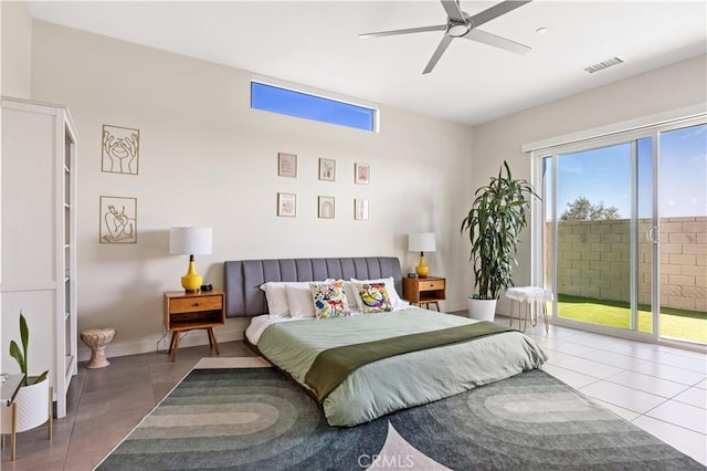 bedroom featuring tile patterned flooring, access to exterior, and ceiling fan