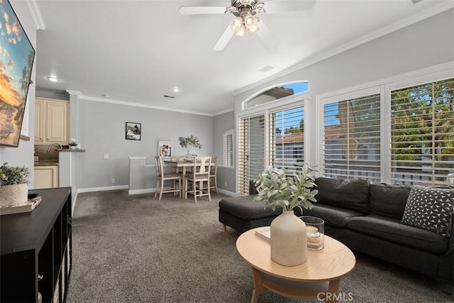 carpeted living room featuring ornamental molding and ceiling fan