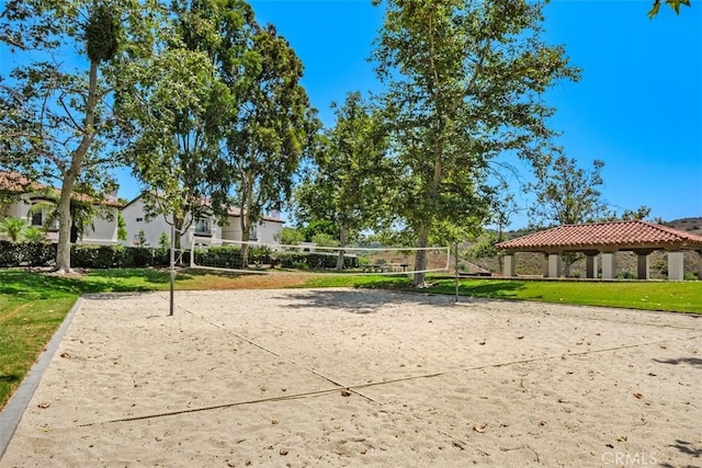 surrounding community with a gazebo, a yard, and volleyball court