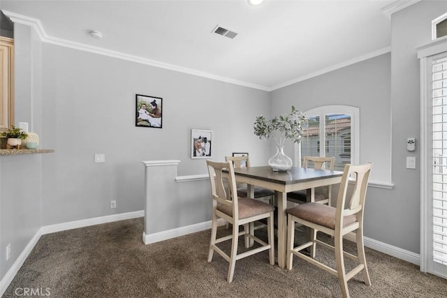 carpeted dining room with crown molding and a wealth of natural light