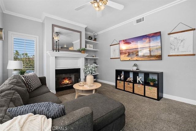 carpeted living room with crown molding and ceiling fan