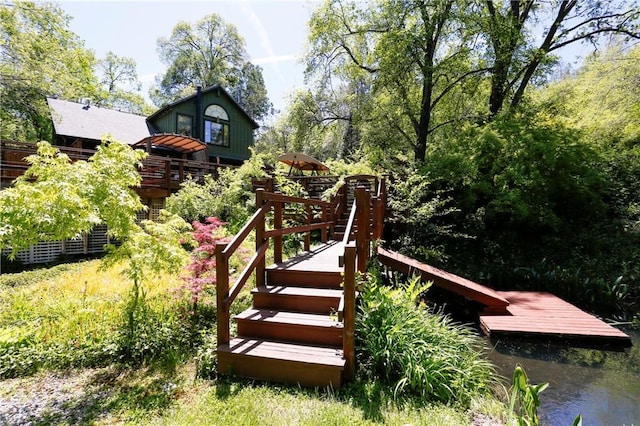 back of house with a water view