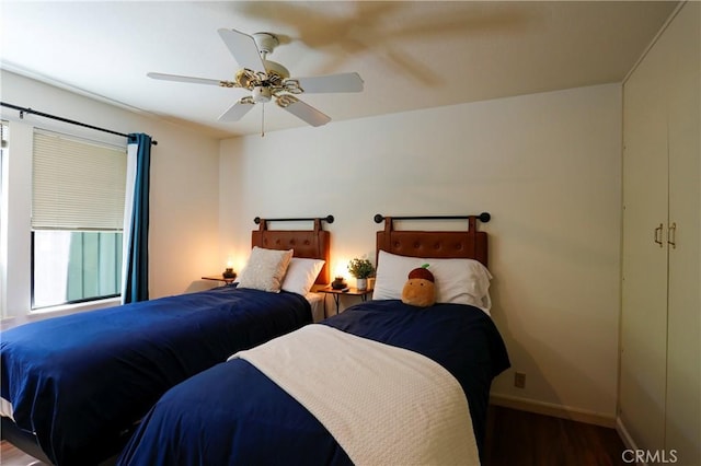 bedroom featuring hardwood / wood-style flooring and ceiling fan