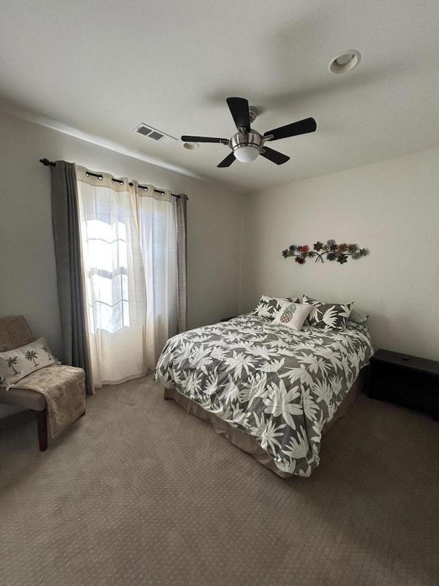 carpeted bedroom featuring ceiling fan