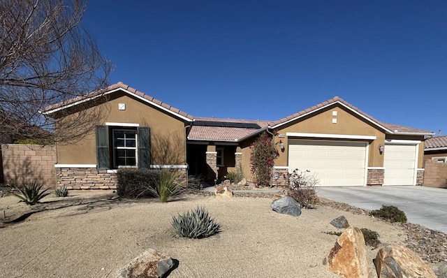 ranch-style home featuring a garage