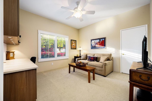 carpeted living room featuring ceiling fan