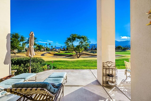 view of patio / terrace with a mountain view