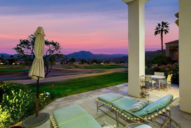 patio terrace at dusk with a mountain view