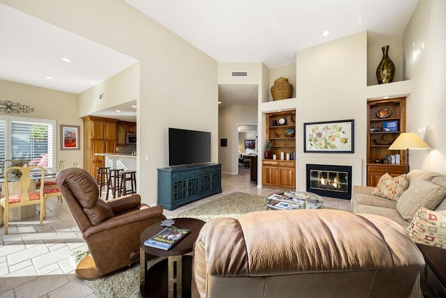 tiled living room with built in shelves