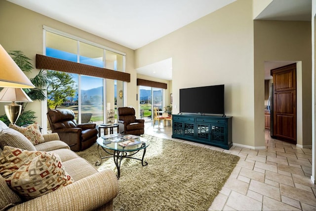 living room featuring a high ceiling