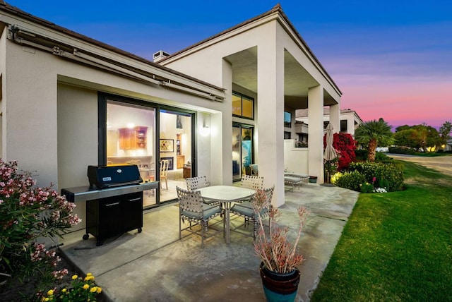 patio terrace at dusk with a yard