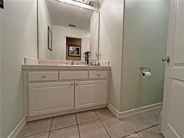 bathroom featuring vanity and tile patterned floors