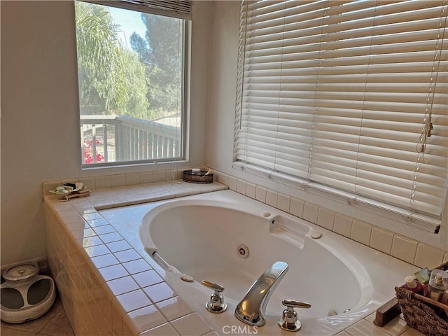 bathroom featuring a relaxing tiled tub